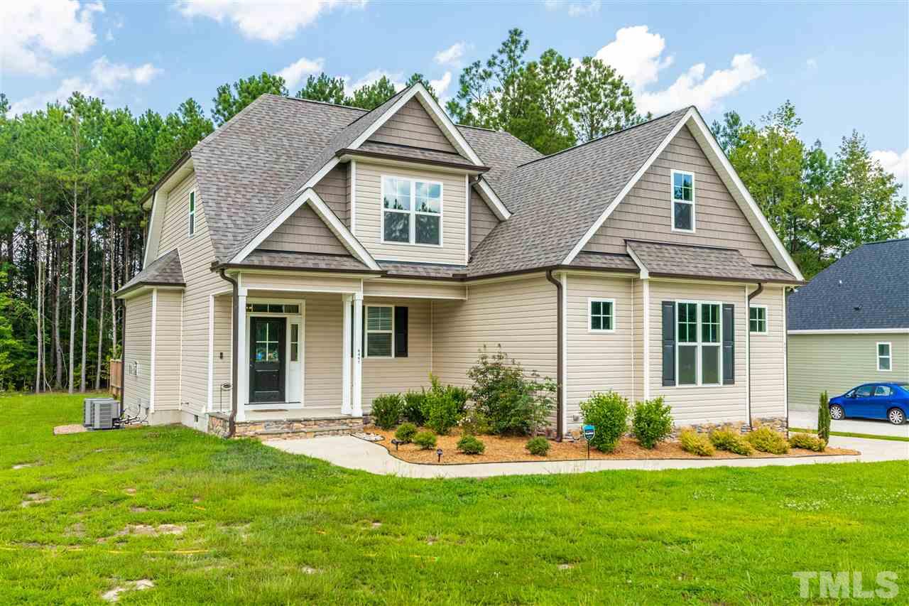 6401 Riley Hill Road Wendell, NC 27591 - Photo 1 of 23 a front view of a house with a yard and porch