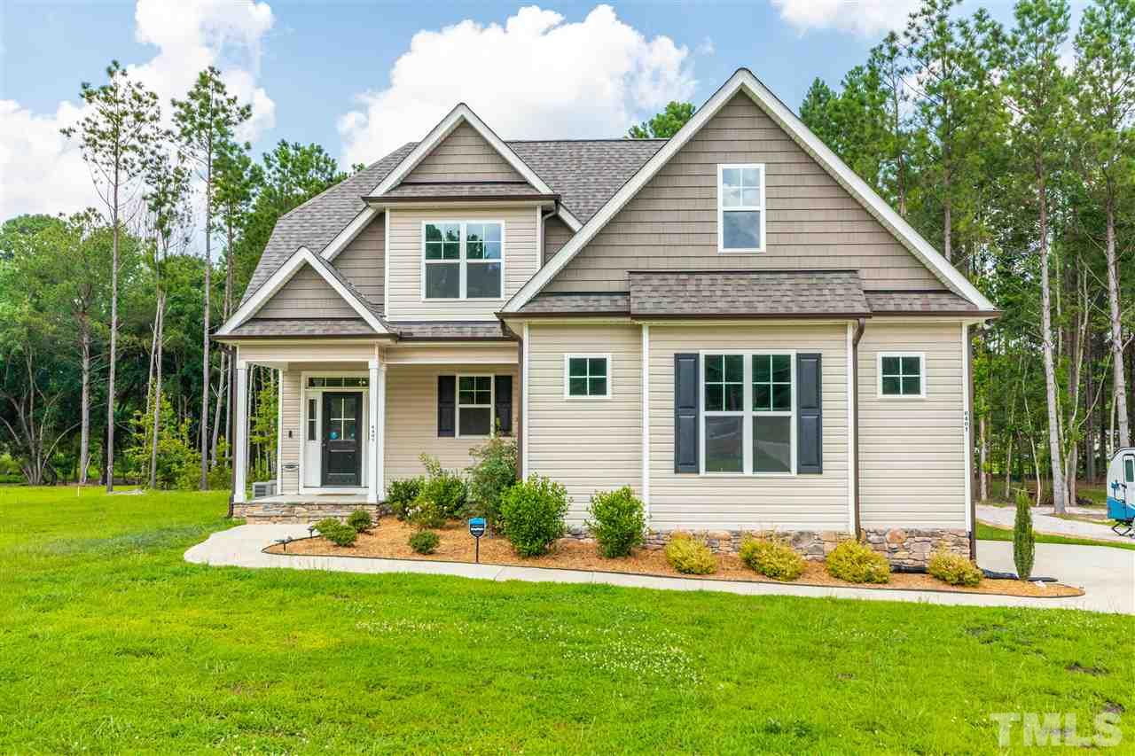 6401 Riley Hill Road Wendell, NC 27591 - Photo 2 of 23 a front view of a house with a yard and porch