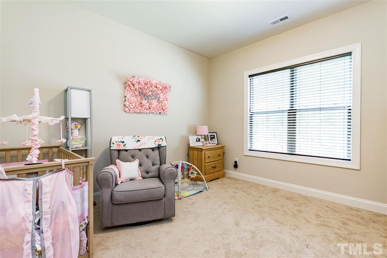 6401 Riley Hill Road Wendell, NC 27591 - Photo 17 of 23 a bed room with a bed and a chair