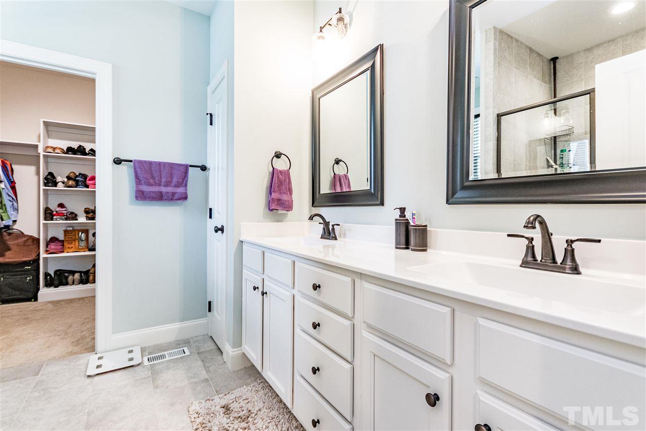 6401 Riley Hill Road Wendell, NC 27591 - Photo 19 of 23 a bathroom with a double vanity sink mirror and