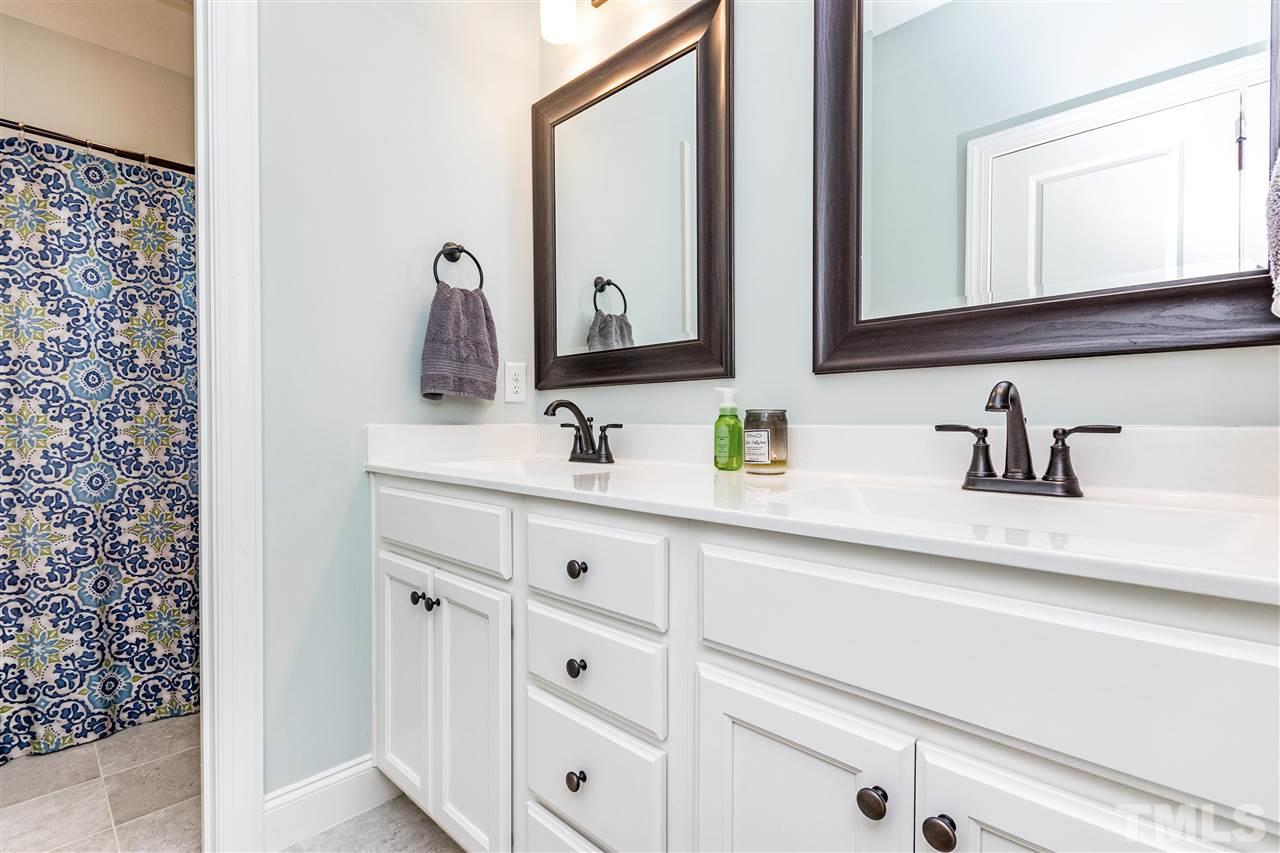 6401 Riley Hill Road Wendell, NC 27591 - Photo 20 of 23 a bathroom with sink and mirror