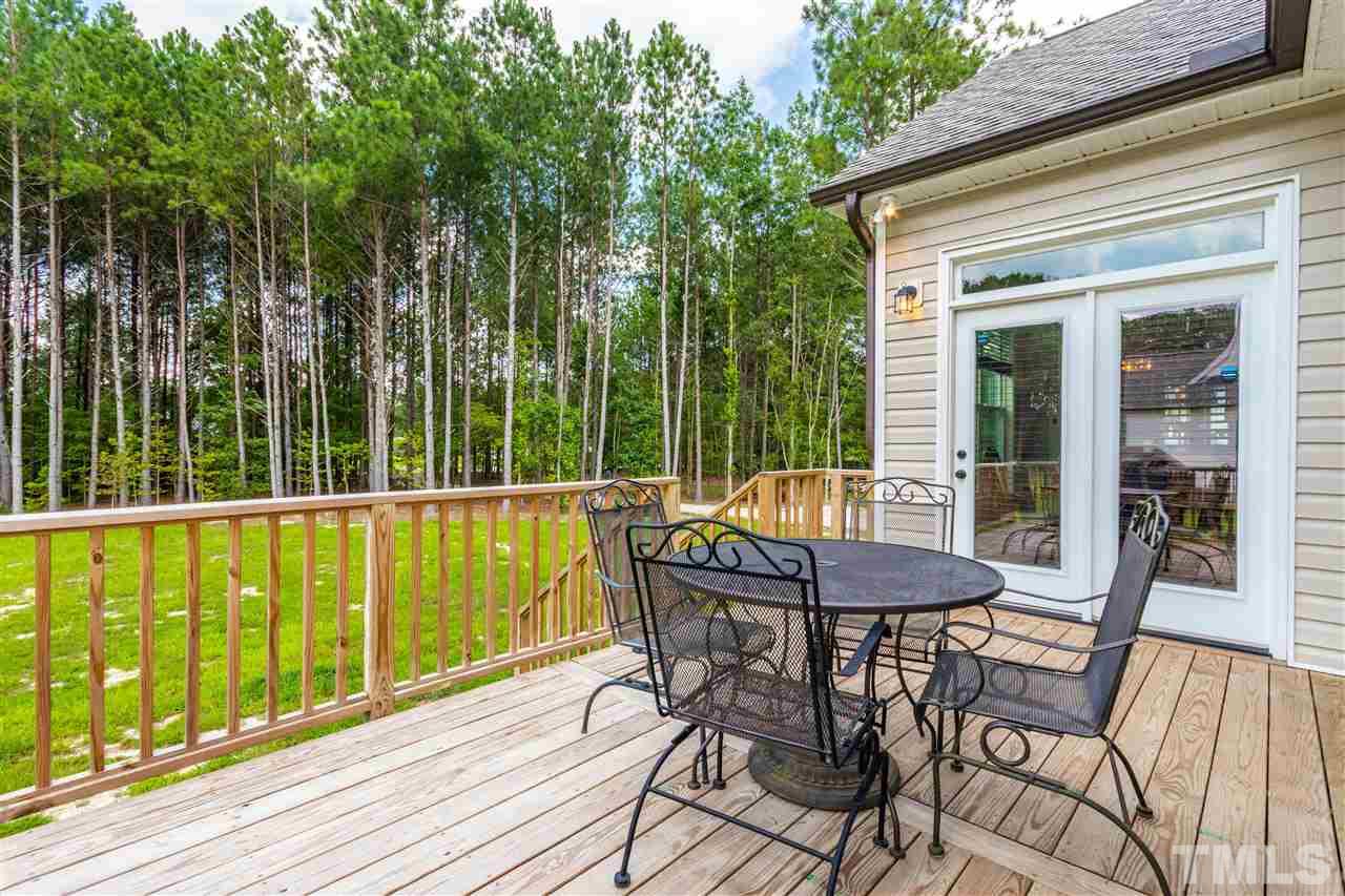 6401 Riley Hill Road Wendell, NC 27591 - Photo 5 of 23 a view of balcony with a table and chairs