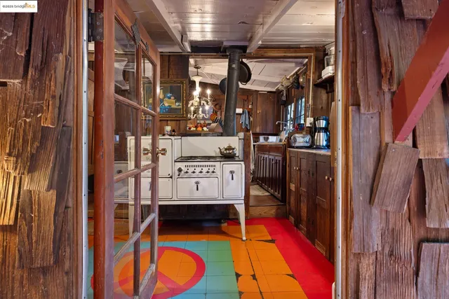 a kitchen with stainless steel appliances granite countertop a sink and wooden cabinets