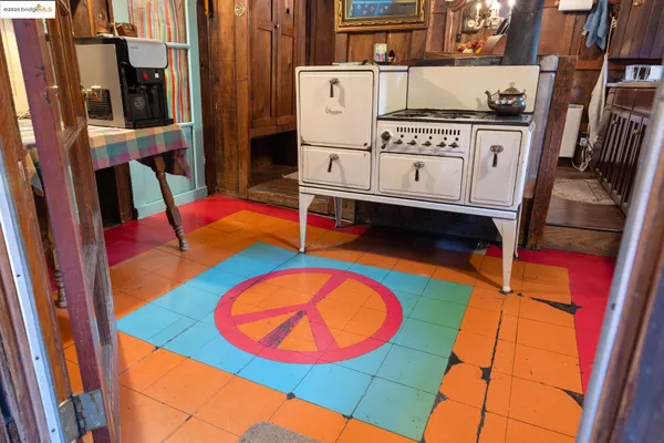 a kitchen with a sink and a mirror