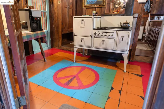 a kitchen with a sink and a mirror