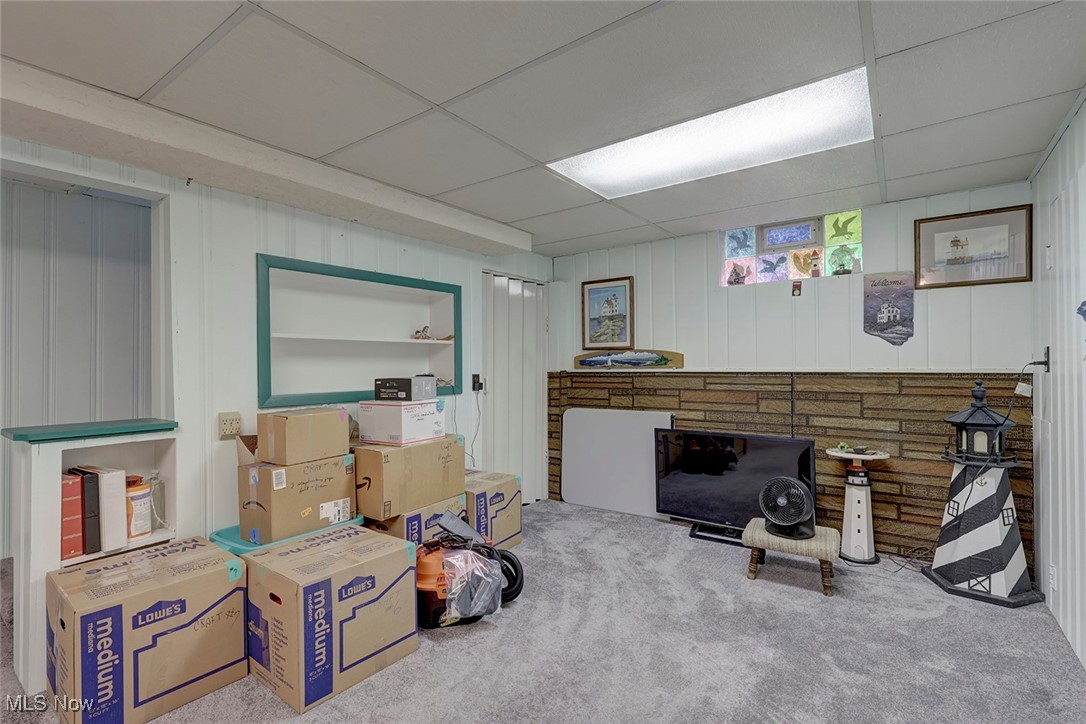1525 Root Road Lorain, OH 44052 - Photo 25 of 41 Basement featuring a drop ceiling and carpet