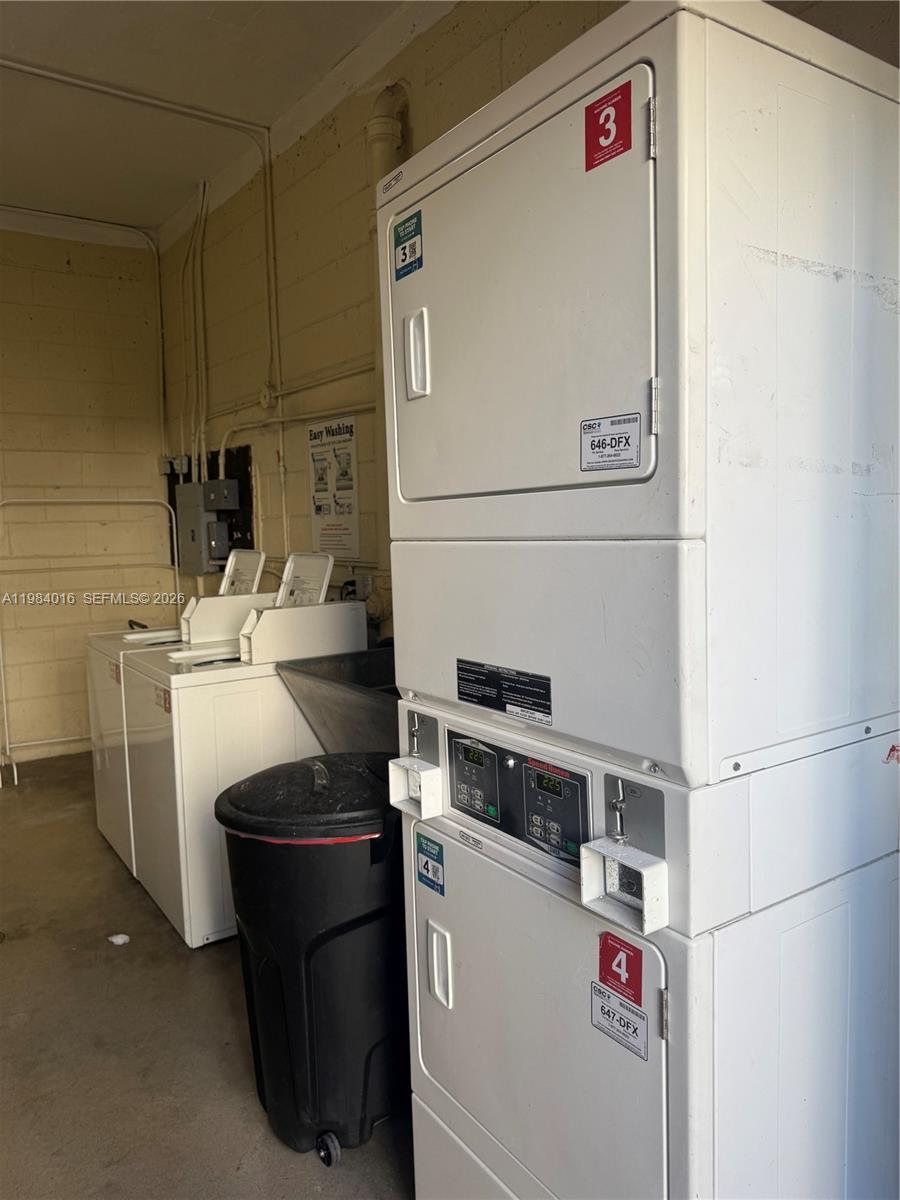 617 Southwest 11th Street, Unit 14E Miami, FL 33129 - Photo 15 of 16 a utility room with dryer and washer