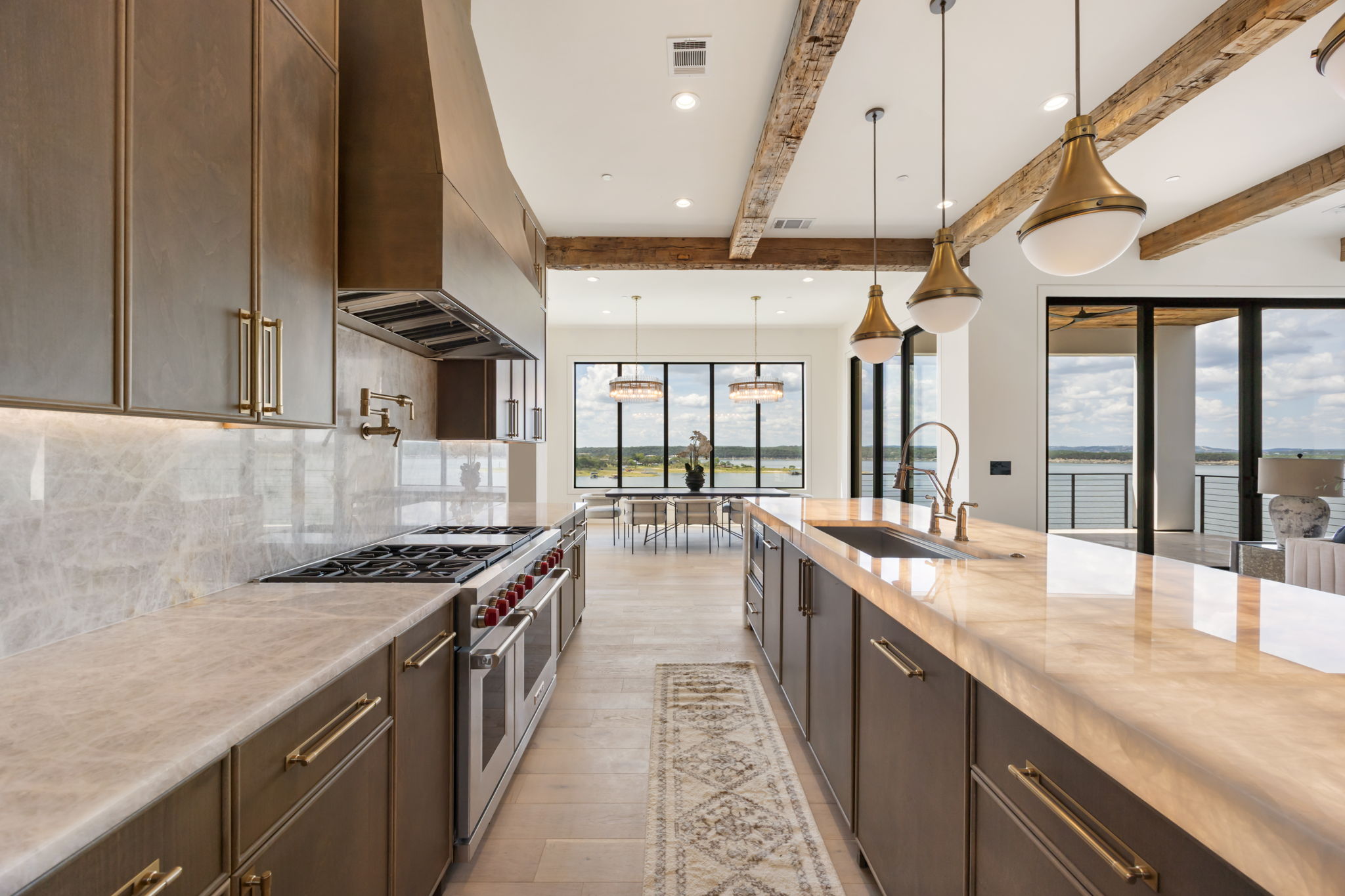 1496 Buffalo Gap Road Lakeway, TX 78734 - Photo 9 of 37 A well-appointed kitchen boasts sleek countertops, stainless steel appliances, and a captivating waterfront panorama.