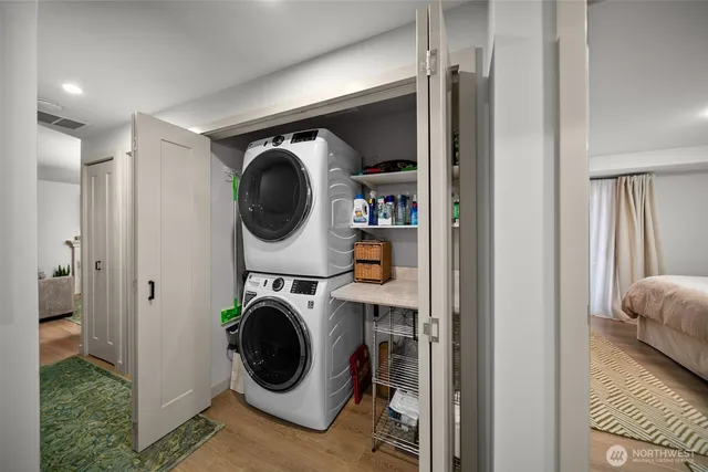 a utility room with sink dryer and washer