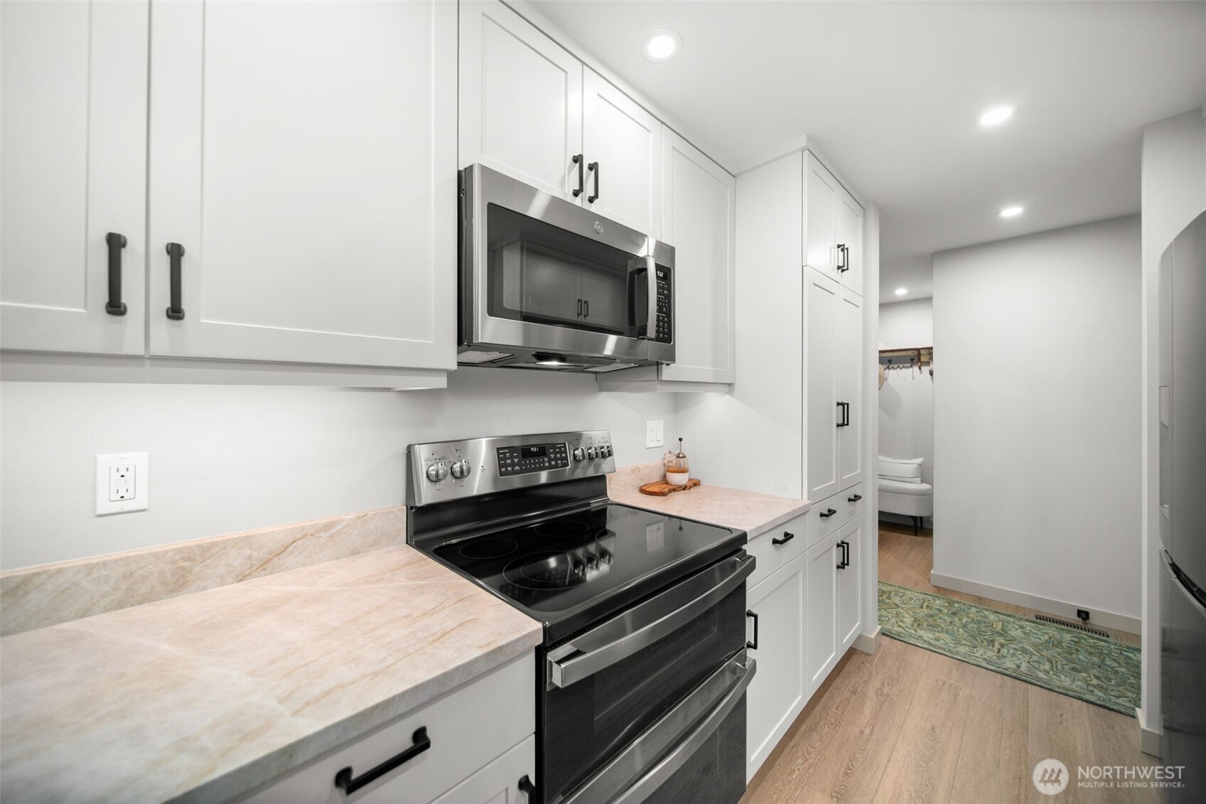 1535 Castlerock Avenue, Unit 26 Wenatchee, WA 98801 - Photo 7 of 32 a kitchen with stainless steel appliances a stove microwave and sink