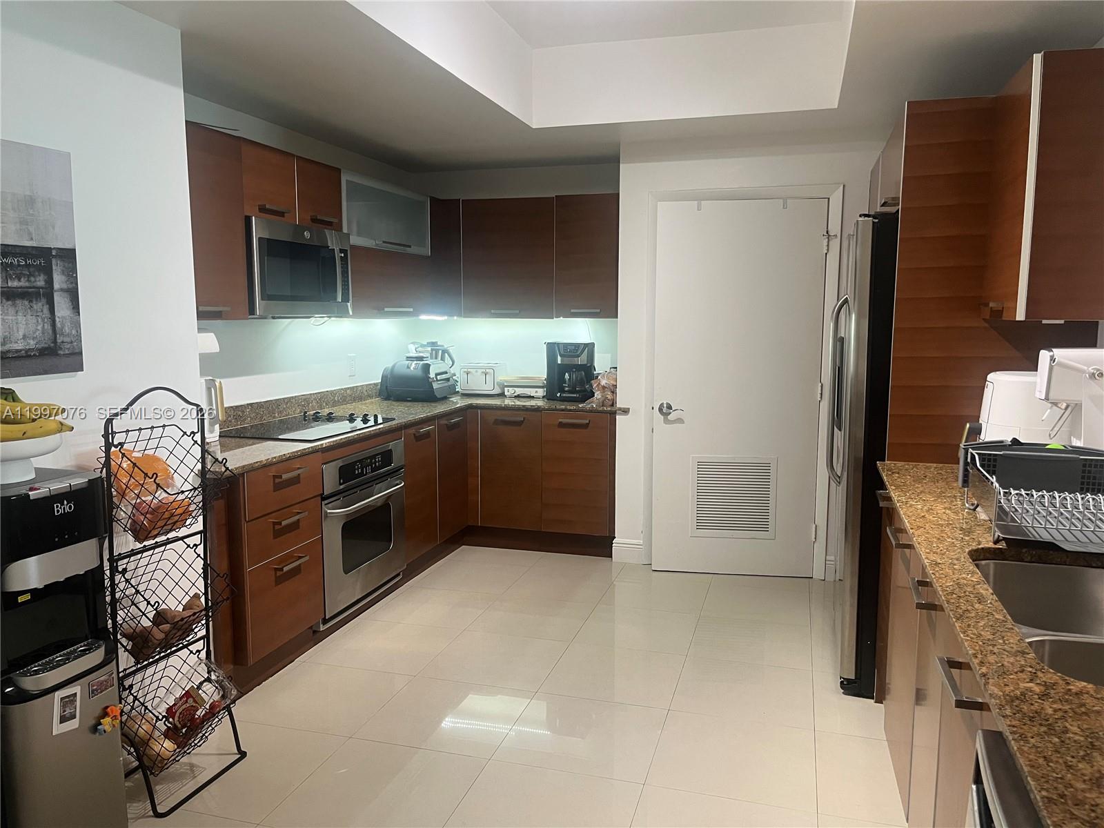 3330 Northeast 190th Street, Unit 1615 Aventura, FL 33180 - Photo 3 of 28 Large Italian style kitchen with laundry room