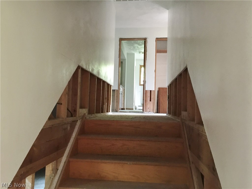 7900 Avon Lake Road Lodi, OH 44254 - Photo 26 of 33 Wide hallway leading to bedrooms and full bath