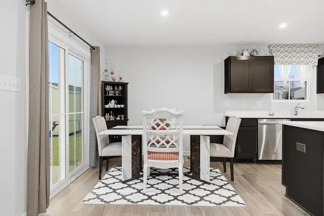 a living room with furniture a table and chairs