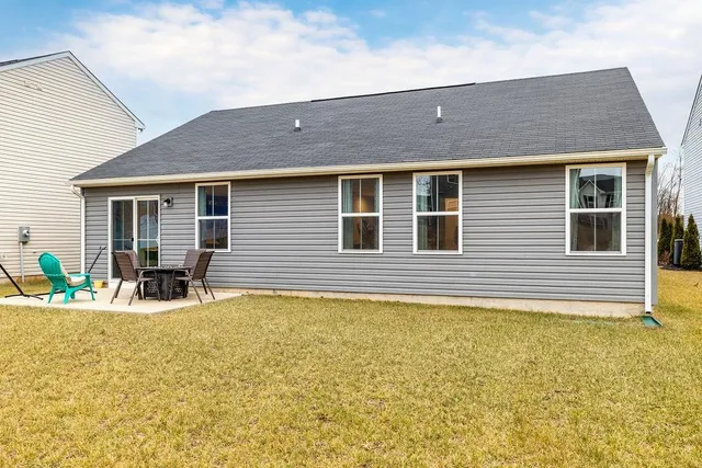 a house view with a outdoor seating space