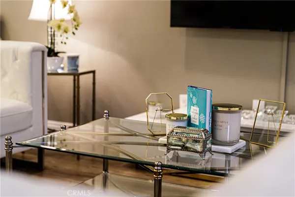 a room with a table chairs and appliances