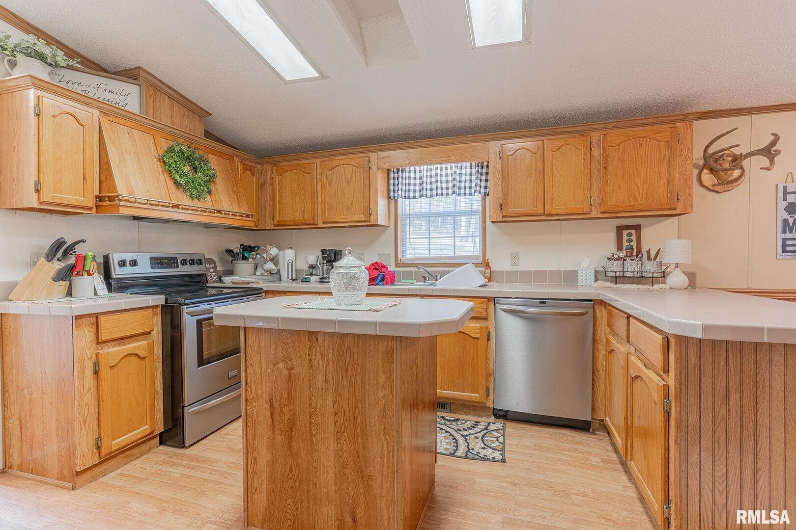 565 Dutton Chapel Road Herod, IL 62947 - Photo 41 of 54 a kitchen with granite countertop a sink stainless steel appliances and cabinets