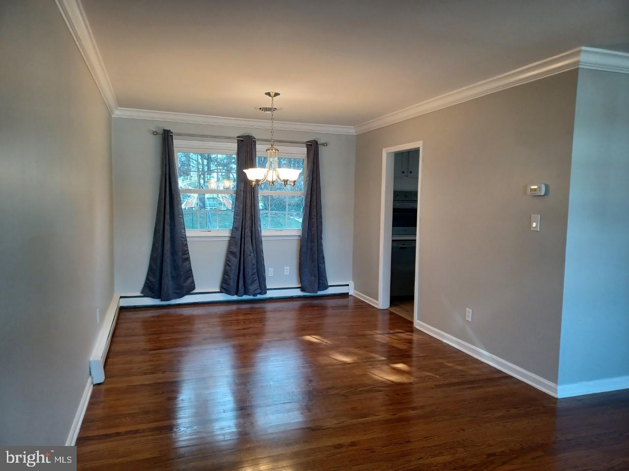 36 Windflower Drive Newark, DE 19711 - Photo 3 of 11 wooden floor in an empty room with a window