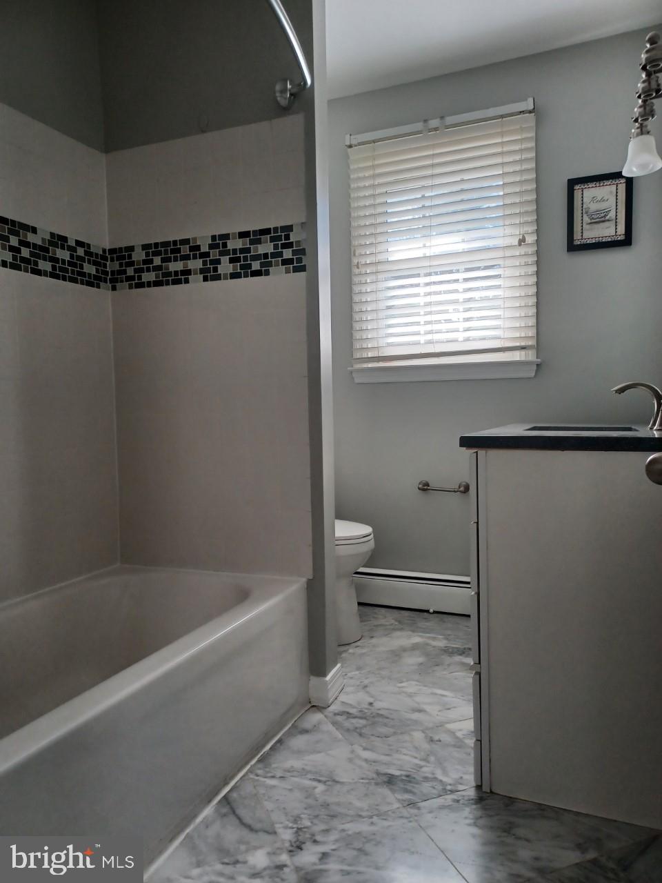 36 Windflower Drive Newark, DE 19711 - Photo 7 of 11 a bathroom with a toilet a sink and bathtub