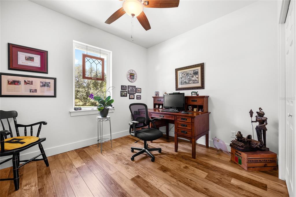 4162 Northeast 27th Lane High Springs, FL 32643 - Photo 26 of 46 a view of a workspace with furniture and a window