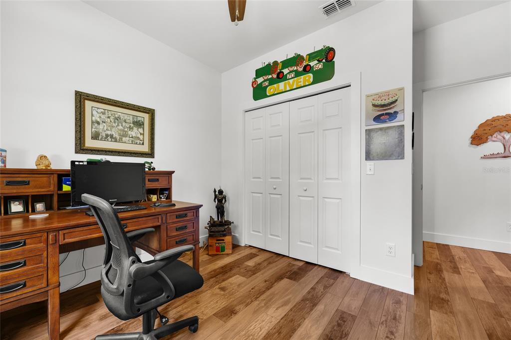 4162 Northeast 27th Lane High Springs, FL 32643 - Photo 27 of 46 a view of a workspace with furniture and wooden floor