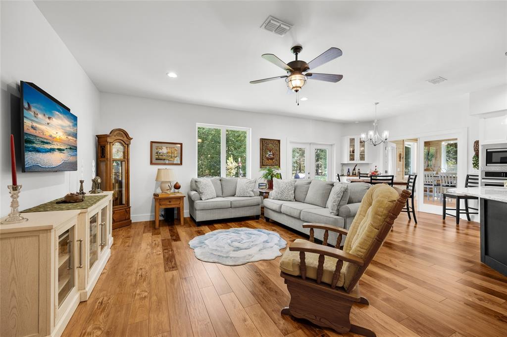 4162 Northeast 27th Lane High Springs, FL 32643 - Photo 5 of 46 a living room with furniture and a flat screen tv