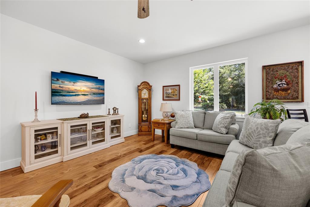 4162 Northeast 27th Lane High Springs, FL 32643 - Photo 6 of 46 a living room with furniture and a flat screen tv