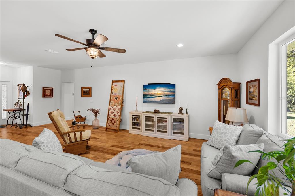 4162 Northeast 27th Lane High Springs, FL 32643 - Photo 7 of 46 a living room with furniture and a flat screen tv