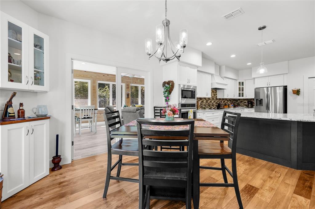 4162 Northeast 27th Lane High Springs, FL 32643 - Photo 10 of 46 a view of kitchen with cabinets and wooden floor