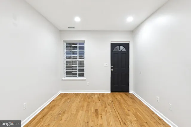 a view of empty room with windows