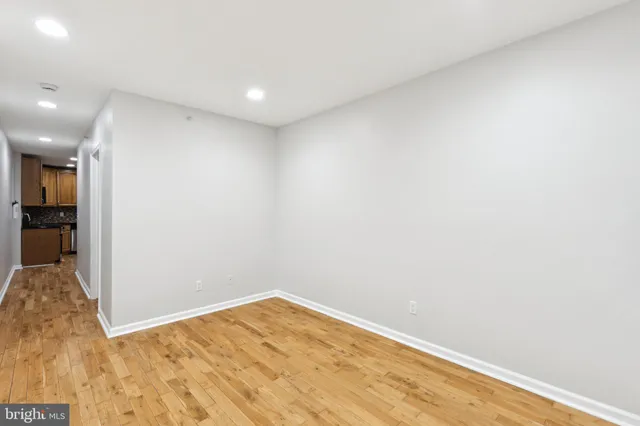 a balcony with wooden floor and fence