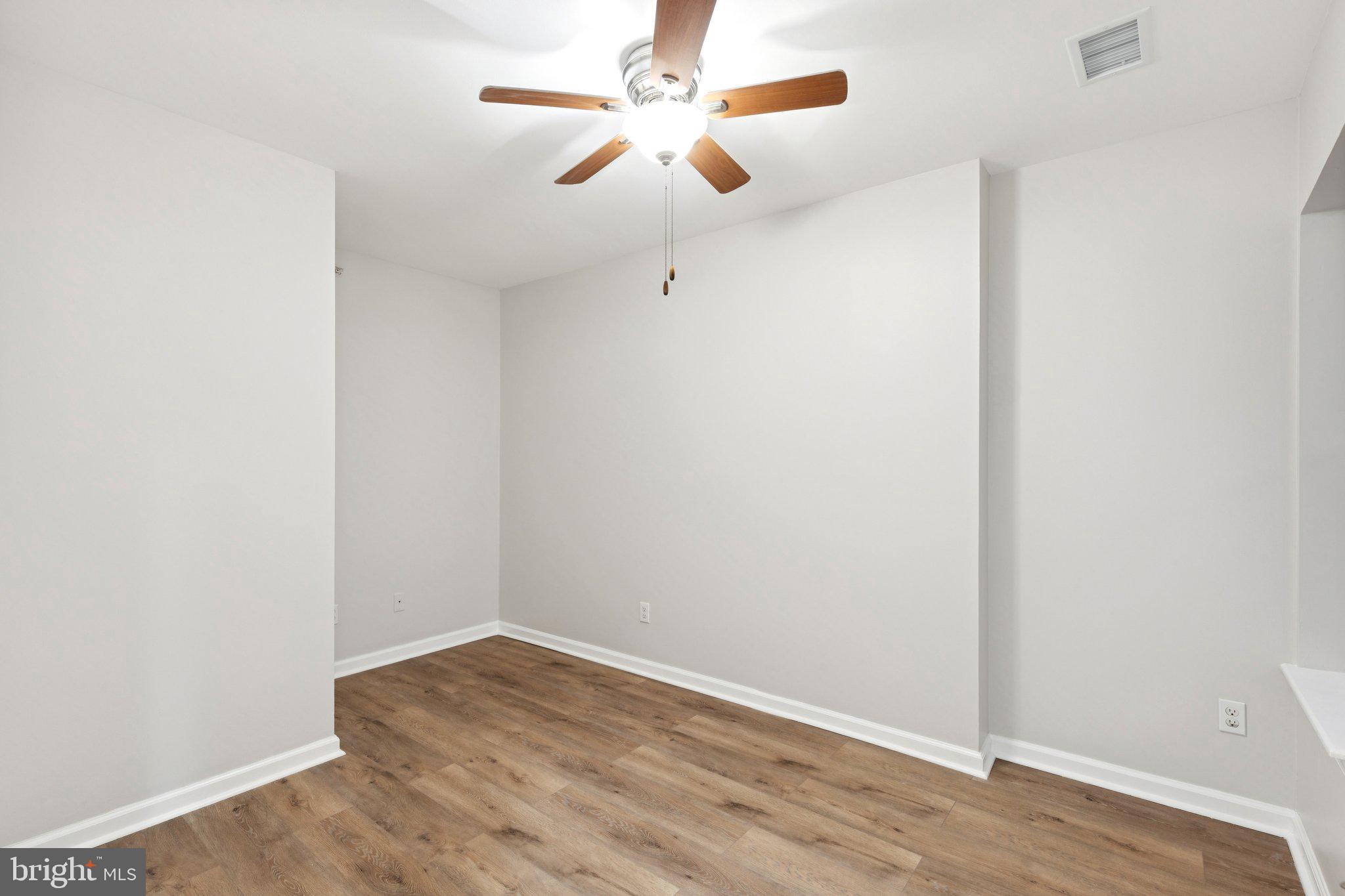 1931 North Uber Street, Unit 2 Philadelphia, PA 19121 - Photo 26 of 26 an empty room with a window and a ceiling fan