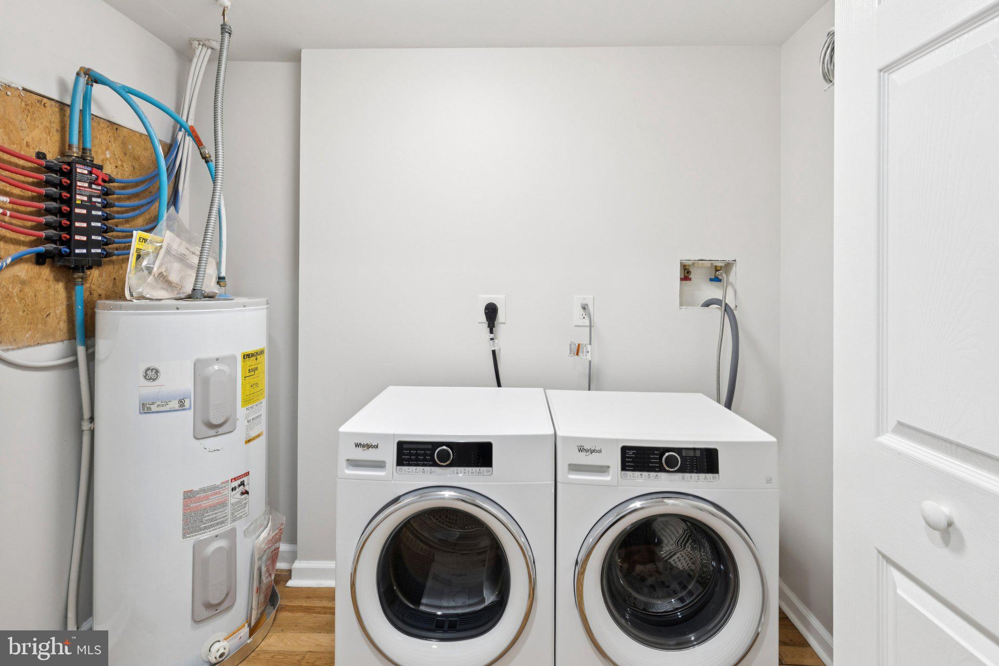 1931 North Uber Street, Unit 2 Philadelphia, PA 19121 - Photo 3 of 26 a utility room with dryer and washer