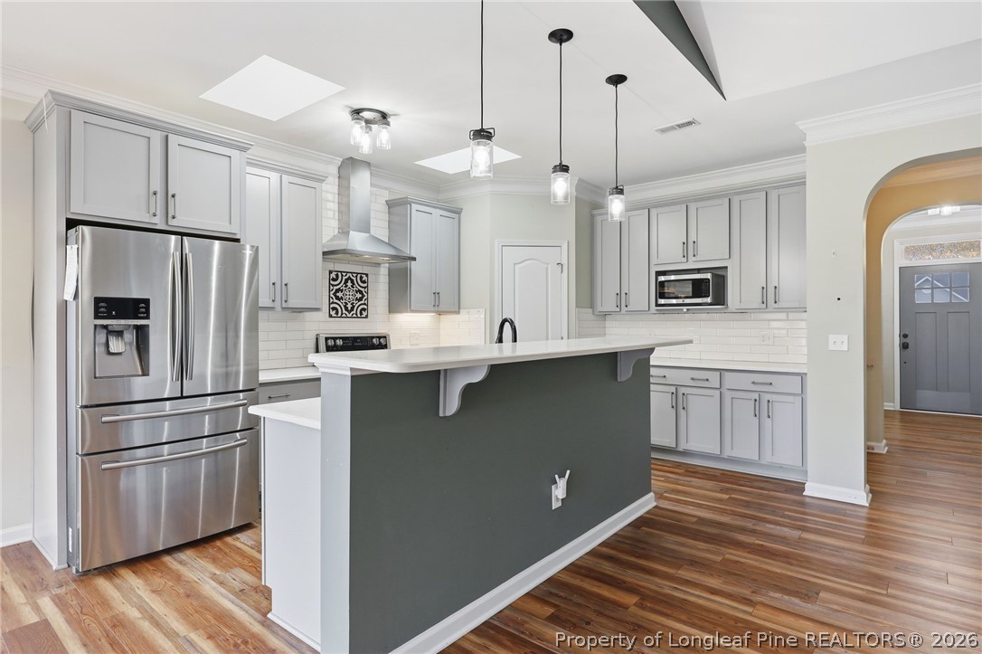 33 Colonist Place Cameron, NC 28326 - Photo 16 of 47 a kitchen with white cabinets and stainless steel appliances