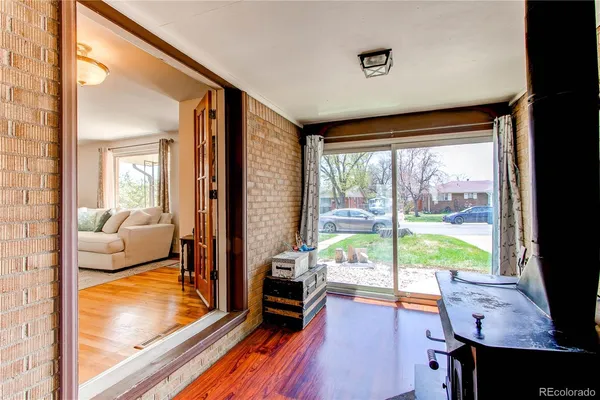a bedroom with furniture and large windows