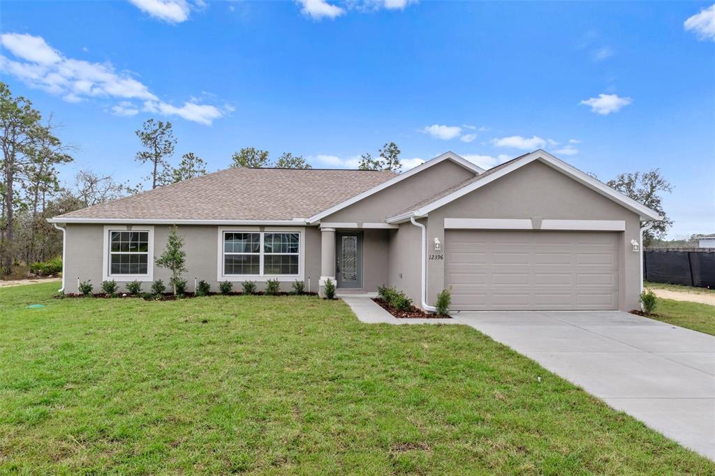 16431 Margot Road Weeki Wachee, FL 34614 - Photo 1 of 1 a front view of house with yard and green space