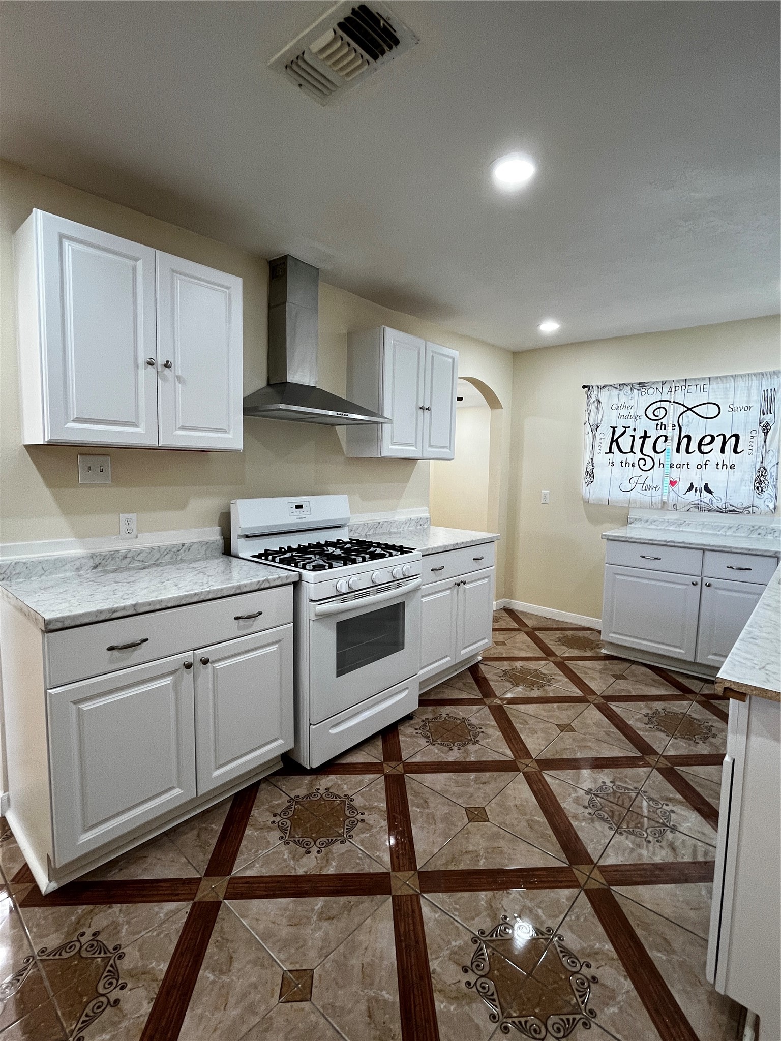 3163 Roe Drive Houston, TX 77087 - Photo 26 of 47 a kitchen with stainless steel appliances granite countertop a stove a sink and a microwave