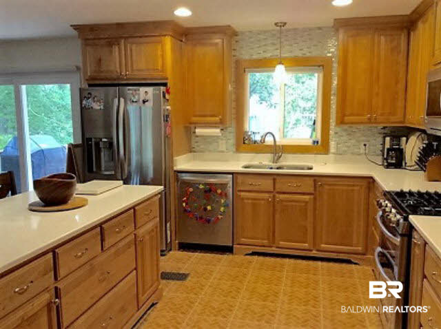 108 Spring Drive Fairhope, AL 36532 - Photo 6 of 24 Kitchen to Back Yard