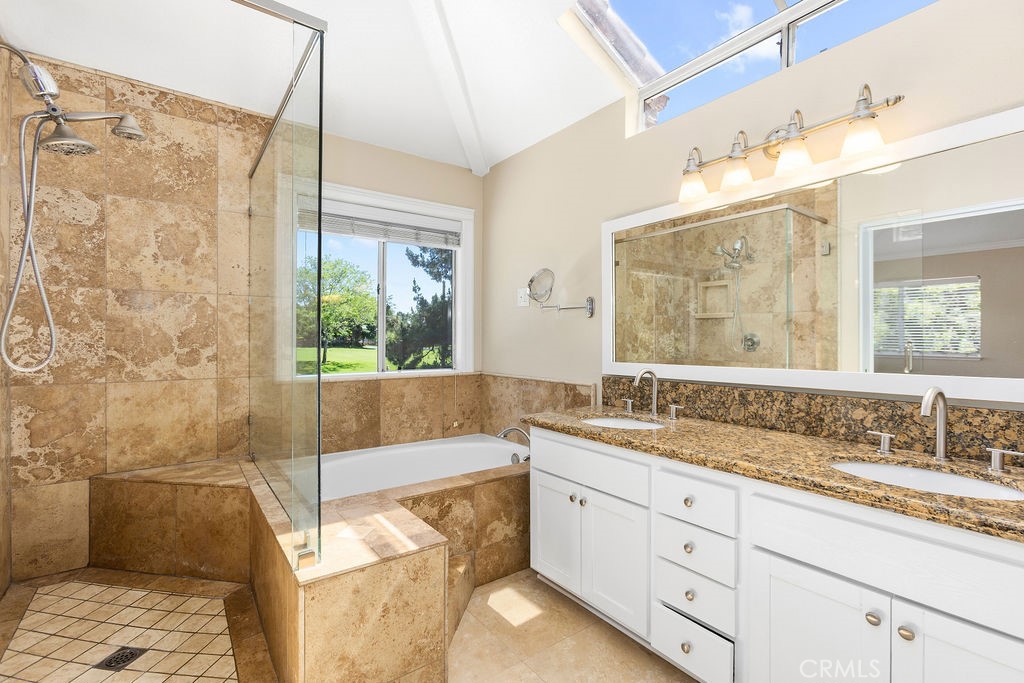 6 Aprilla Irvine, CA 92614 - Photo 16 of 37 Private Primary bathroom with spacious shower, bathtub, 2 sinks & great light from the skylight