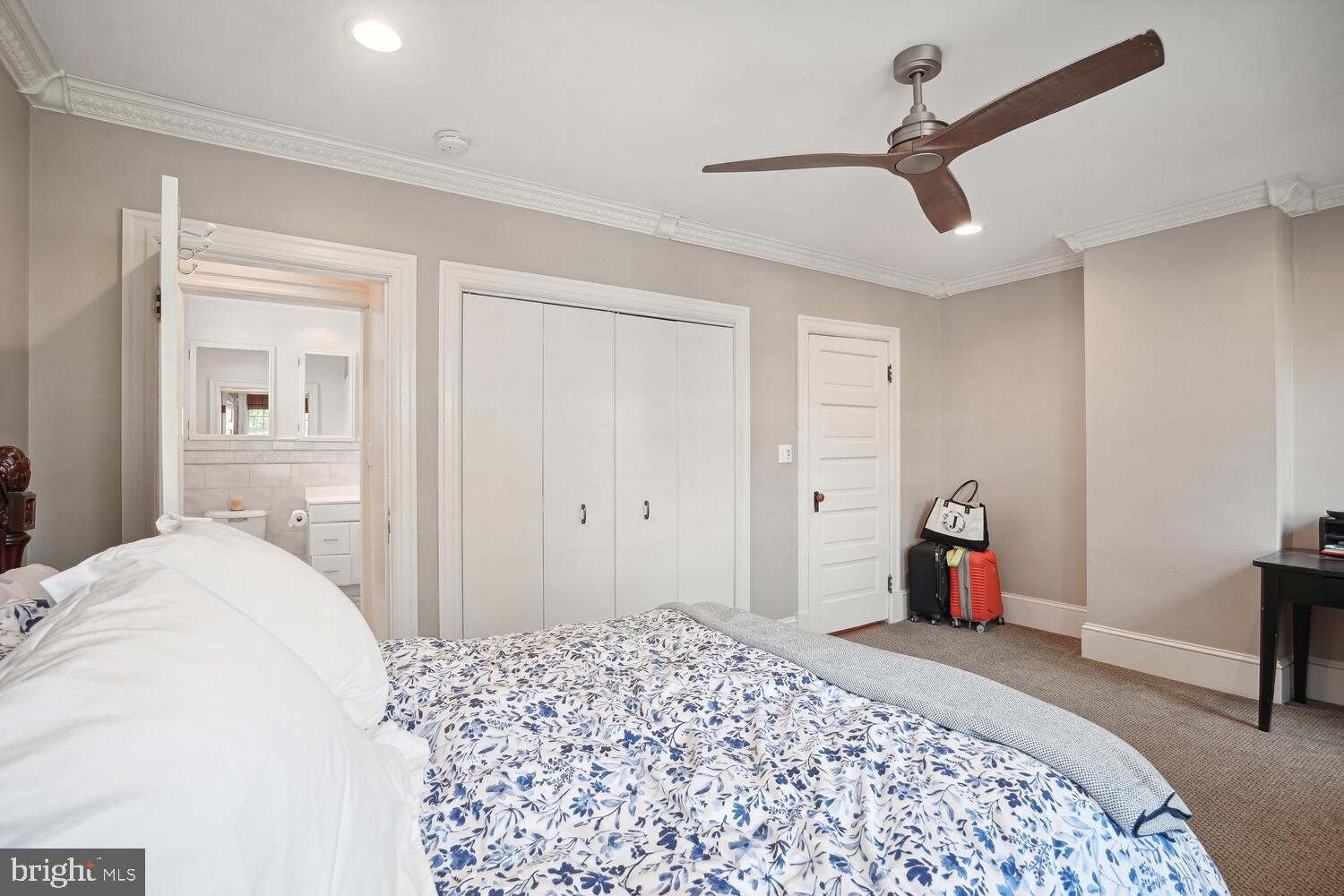 2924 Newark Street Northwest Washington, DC 20008 - Photo 18 of 26 a bedroom with a bed and a dresser in it