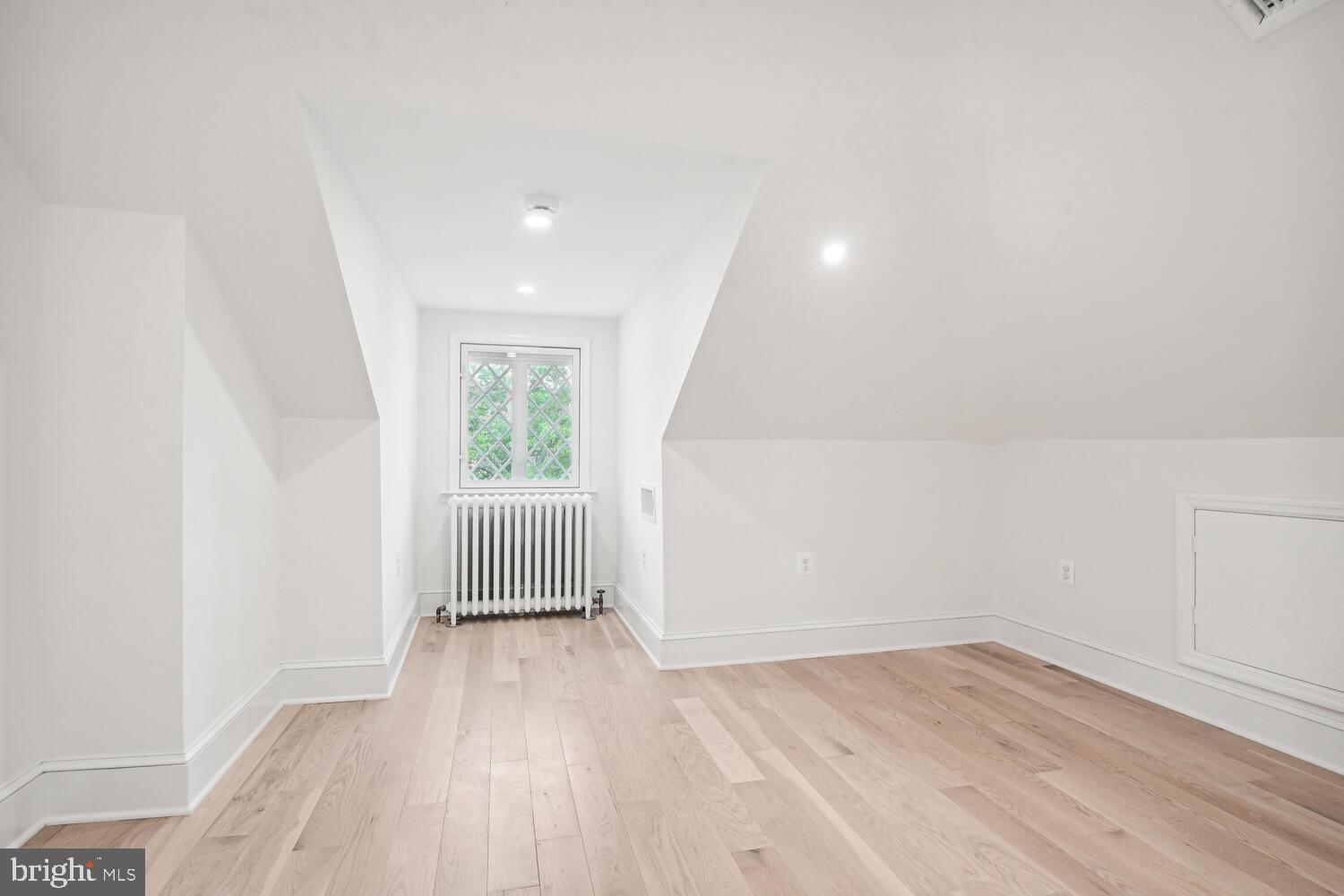 2924 Newark Street Northwest Washington, DC 20008 - Photo 23 of 26 wooden floor in an empty room with a window