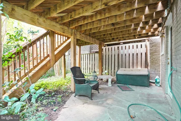 a balcony with furniture and a potted plant