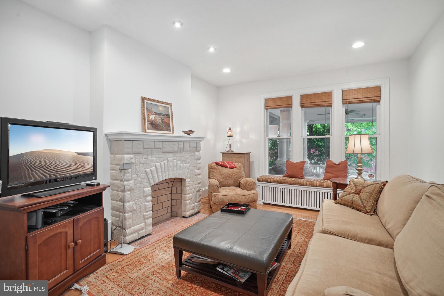 2924 Newark Street Northwest Washington, DC 20008 - Photo 3 of 26 a living room with furniture and a fireplace