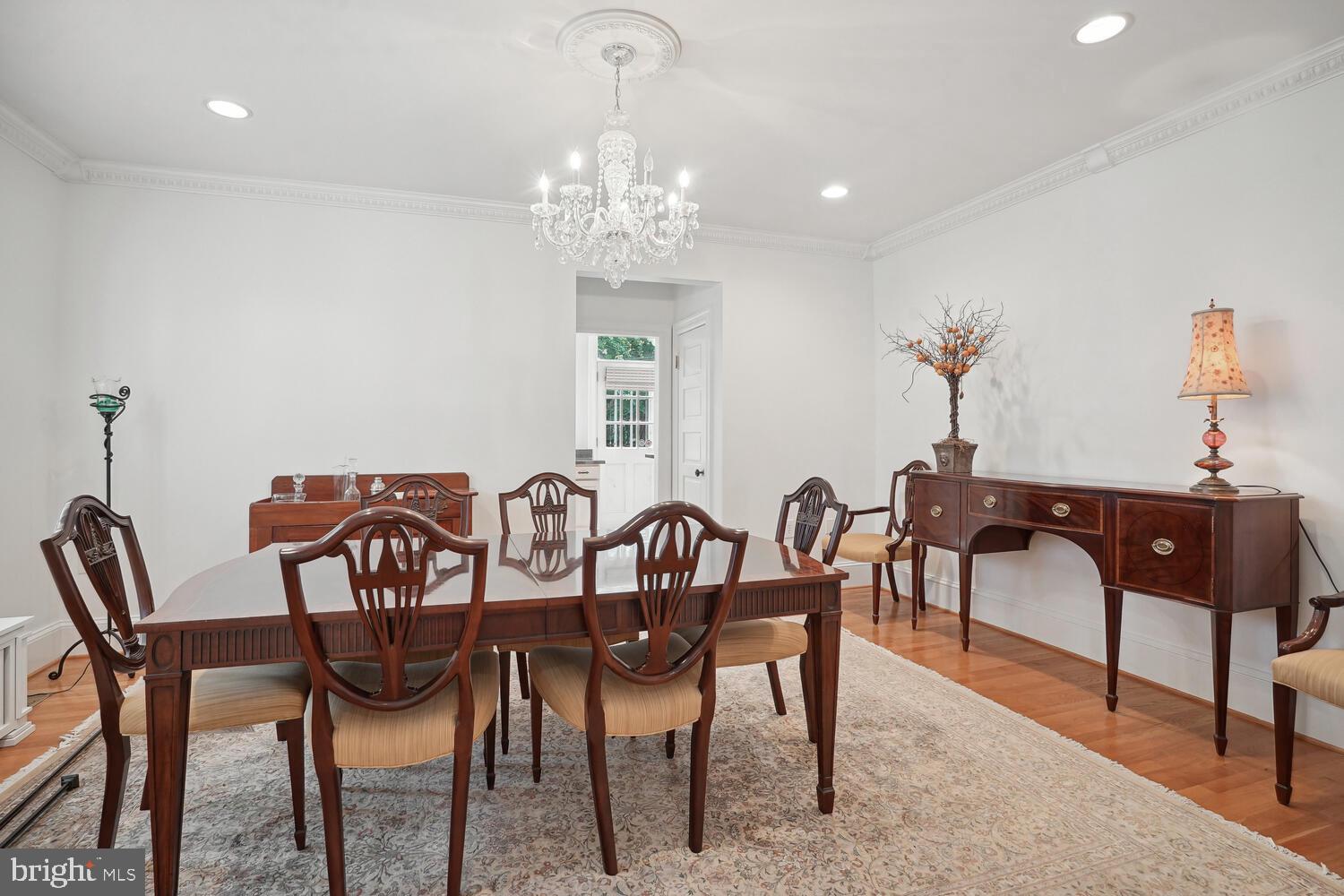 2924 Newark Street Northwest Washington, DC 20008 - Photo 7 of 26 a view of a dining room with furniture and chandelier