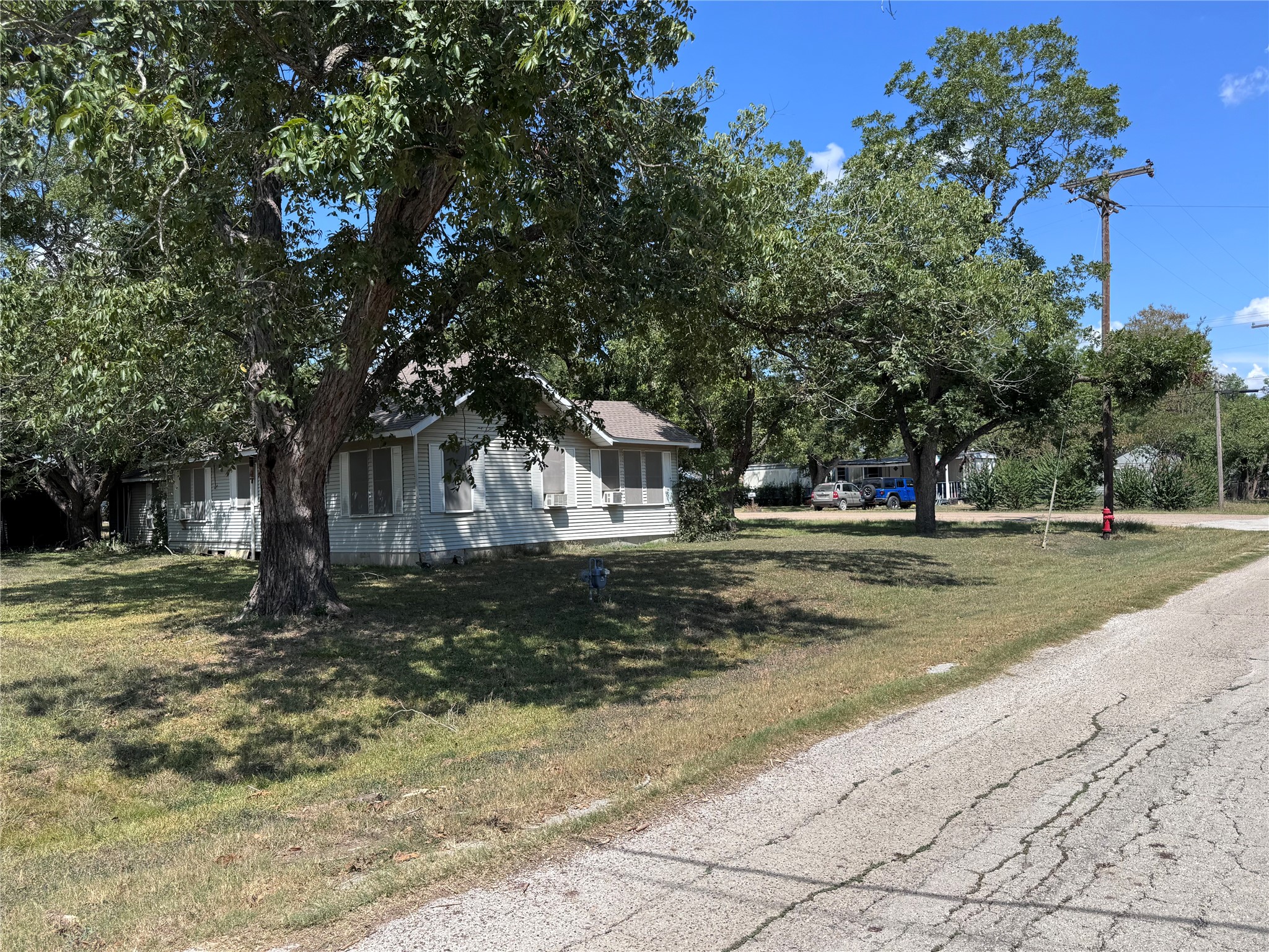 1402 West 9th Street Caldwell, TX 77836 - Photo 2 of 10 a view of street with trees