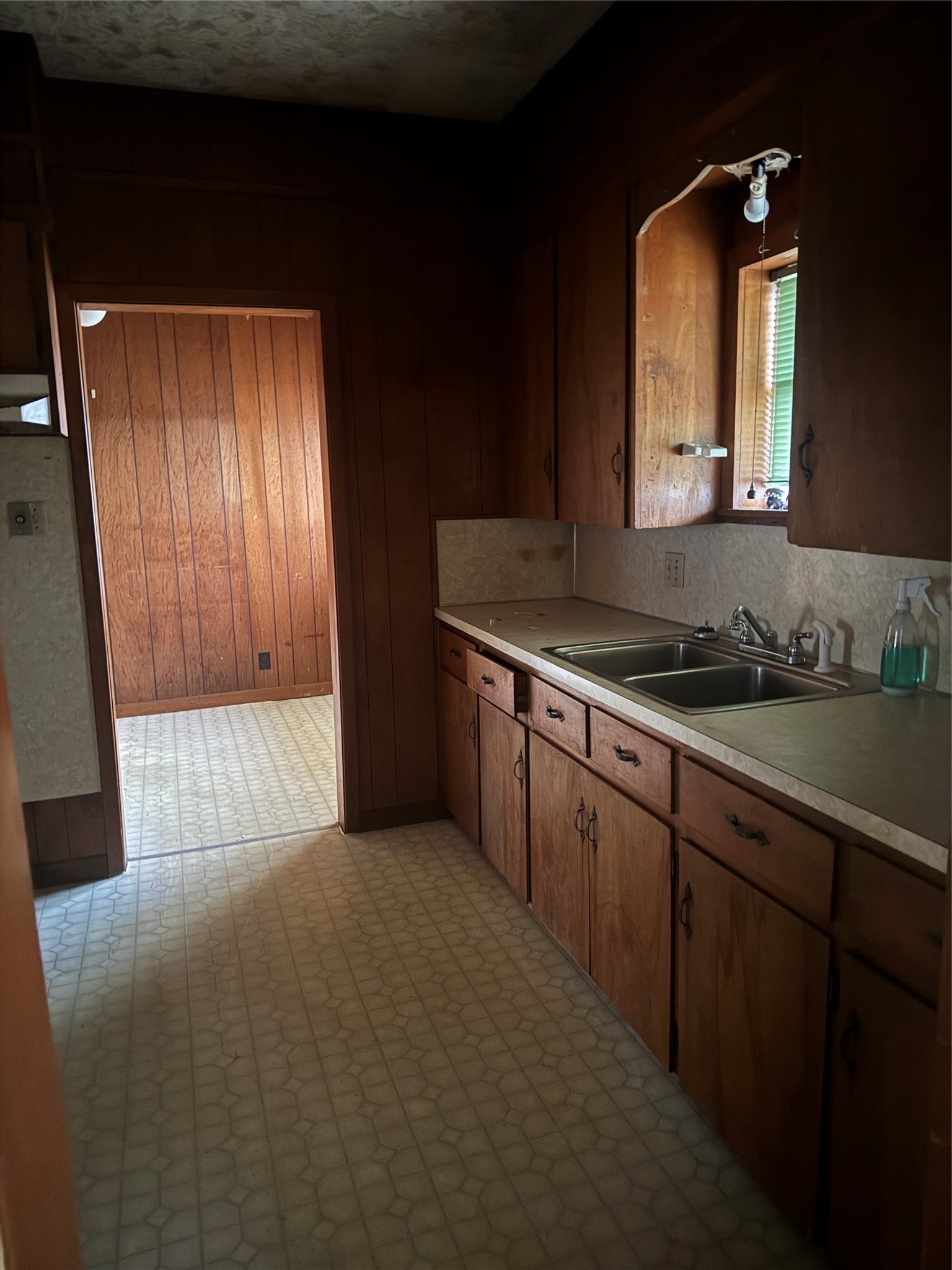 1402 West 9th Street Caldwell, TX 77836 - Photo 3 of 10 a bathroom with a sink a mirror and cabinets