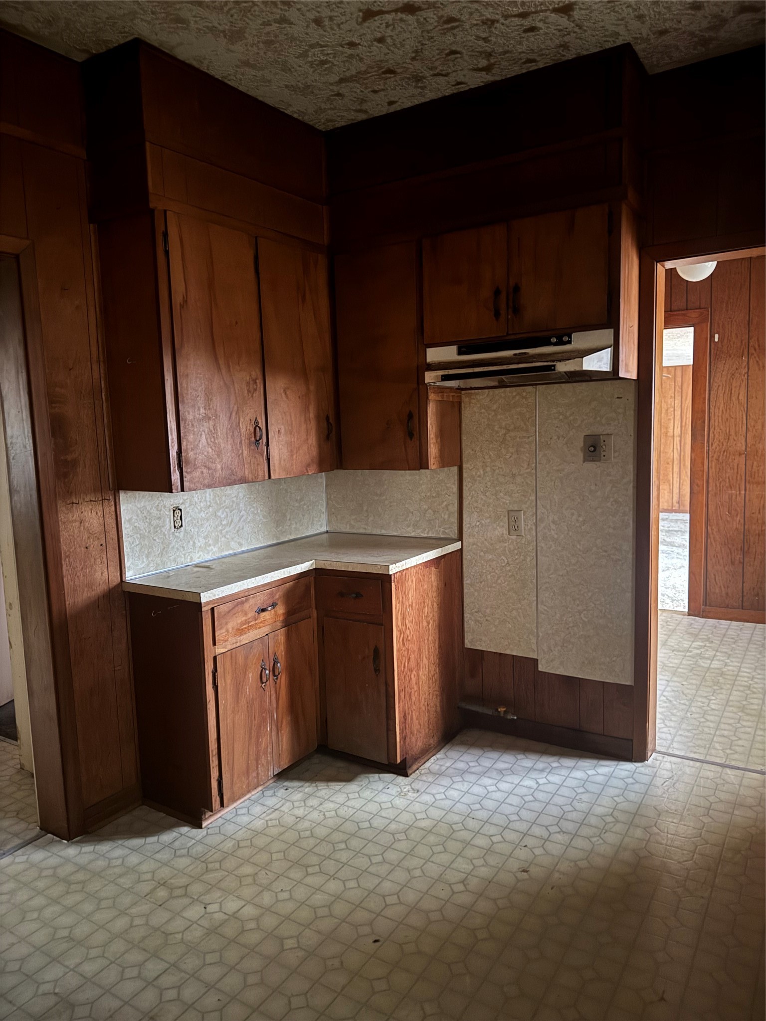 1402 West 9th Street Caldwell, TX 77836 - Photo 4 of 10 a kitchen with a refrigerator and cabinets