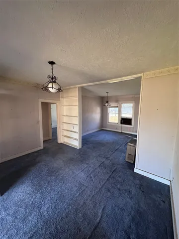 a view of a room with wooden walls