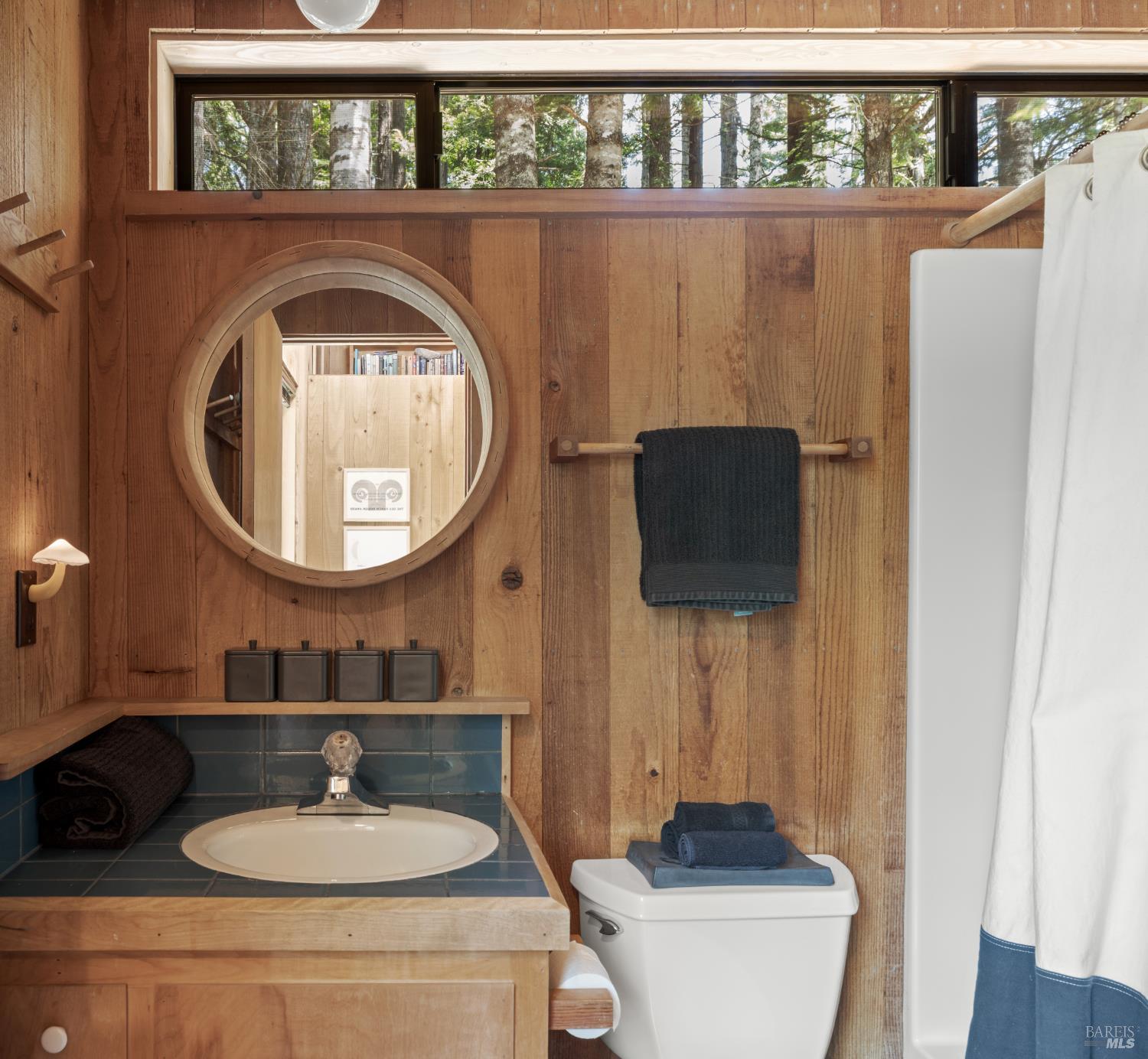 36778 Timber Ridge Road The Sea Ranch, CA 95497 - Photo 29 of 44 a bathroom with a sink a mirror and a toilet