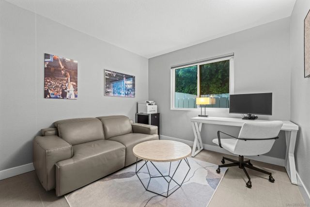 a work room with furniture and a window