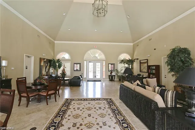 a living room with fireplace furniture and a rug